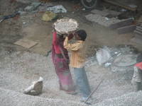 Women&rsquo;s lib. in action:  carrying gravel